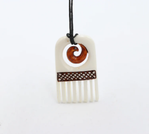 Bone Comb And Koru Pendant With Staining