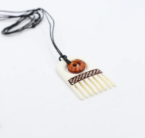 Bone Comb And Koru Pendant With Staining